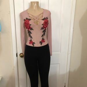 Pink flowered body suit